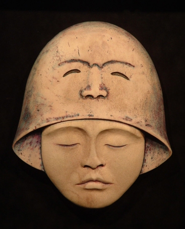 'Bell-Faced Helmet' (carved and and coloured antler) by Maureen Morris